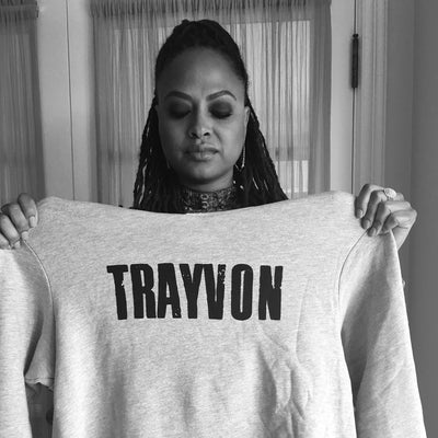 Director Ava DuVernay poses in Liberated People casual activism apparel brand Our Son Trayvon hoodie, supporting social justice causes The Trayvon Martin Foundation.
