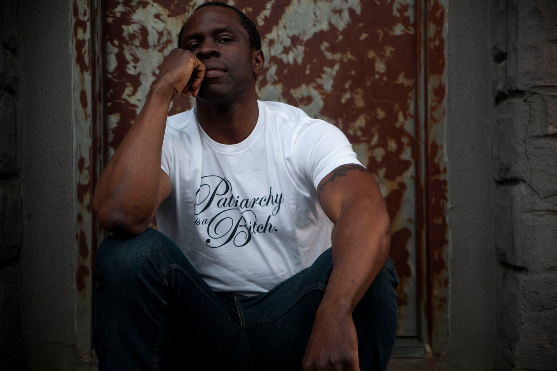 Actor and activist Gbenga Akinnagbe posts in Liberated People activism apparel white t shirt with 